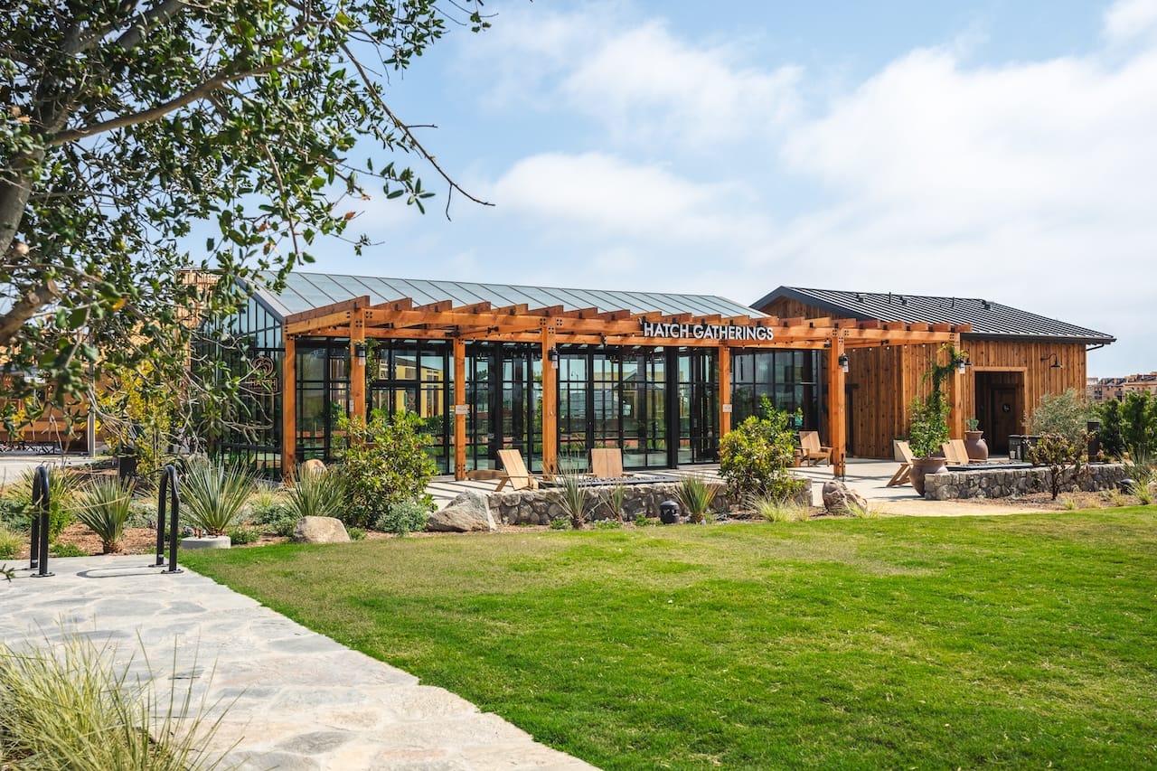 Photo image of Fox Point Farms' greenhouse event space, with transparent views of the landscape.